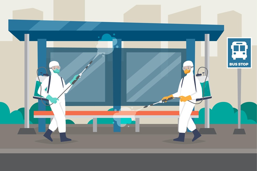 An illustration showing two people in full white protective suits (PPE) and masks sanitizing a bus stop using sprayers.